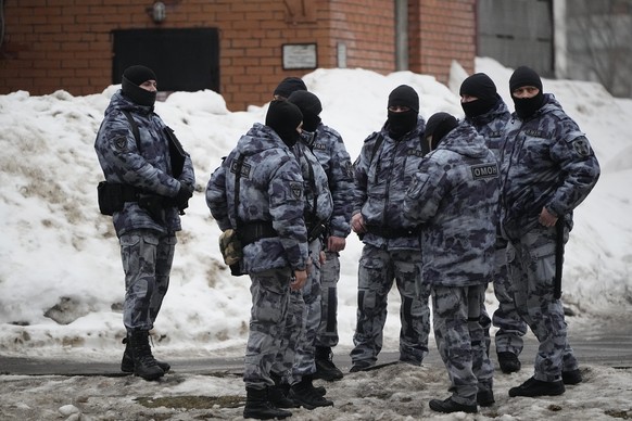 Riot police officers guard the area near the Church of the Icon of the Mother of God, soothes my sorrow, in Moscow, Russia, Friday, March 1, 2024. Relatives and supporters of Alexei Navalny offer…