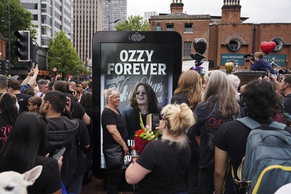 A sign honours musician Ozzy Osbourne as thousands of fans gathered to watch a funeral procession for Black Sabbath frontman Ozzy Osbourne following his death aged 76, in Birmingham, England, Wednesda ...