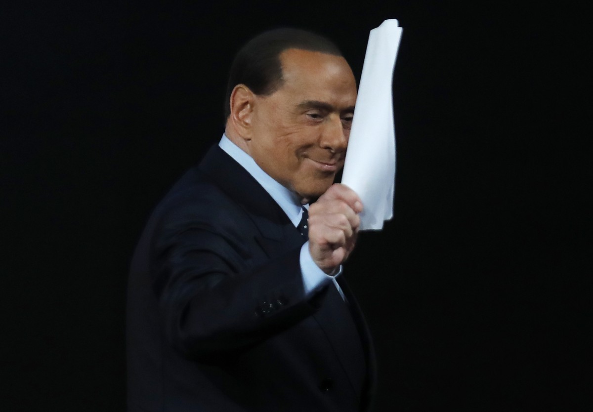 FILE - Italian former premier Silvio Berlusconi waves at the end of the Italian State RAI TV program "Che Tempo che Fa", in Milan, Italy, Sunday, Nov. 26, 2017. Italy is poised to elect a ne ...