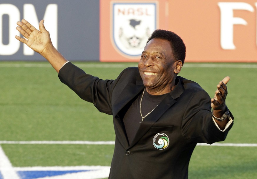 FILE - In this Aug. 3, 2013, file photo, Brazilian soccer legend Pele waves to the crowd during a pregrame cereomy before an NASL soccer game between the New York Cosmos and the Fort Lauderdale Strike ...