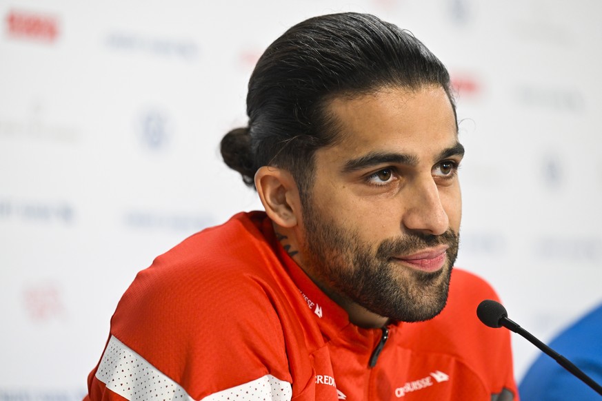 epa10207418 Switzerland's Ricardo Rodriguez and head coach Murat Yakin, during a press conference at the kybunpark stadium, in St. Gallen, Switzerland, 26 September 2022 one day ahead of the Switzerla ...