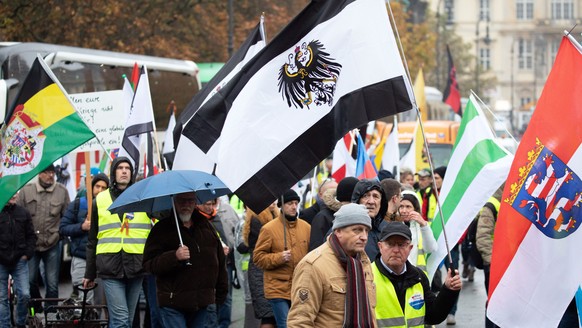epa07983488 A march of the far-right group &#039;Reichsbuerger&#039; (lit. Citizens of the Reich) in Berlin, Germany, 09 November 2019. Demonstrators from several anti-fascist and left-wing organizati ...