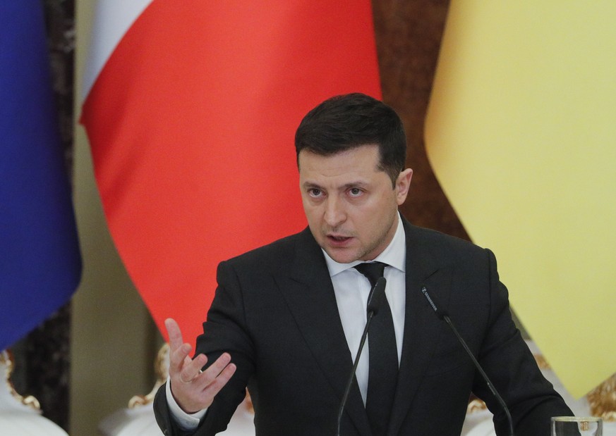 epa09738740 Ukrainian President Volodymyr Zelensky holds a joint press conference with his French counterpart following their meeting in Kiev, Ukraine, 08 February 2022. French President Macron is in  ...