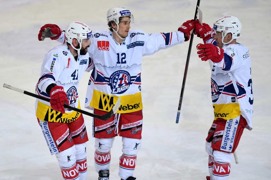 Laker&#039;s player Steve Moses, center, celebrates the 1:2 goal with Laker&#039;s player Leonardo Profico left, and Laker&#039;s player Kevin Clark, right, during the preliminary round game of Nation ...