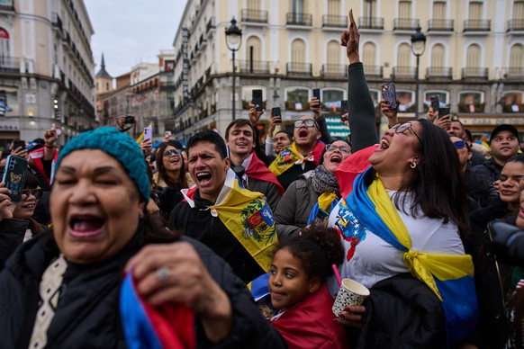 Venezuelans celebrate in Madrid after U.S. President Donald Trump announced that Venezuelan President Nicolás Maduro had been captured and flown out of the country on Saturday, Jan. 3, 2026. (AP Photo ...