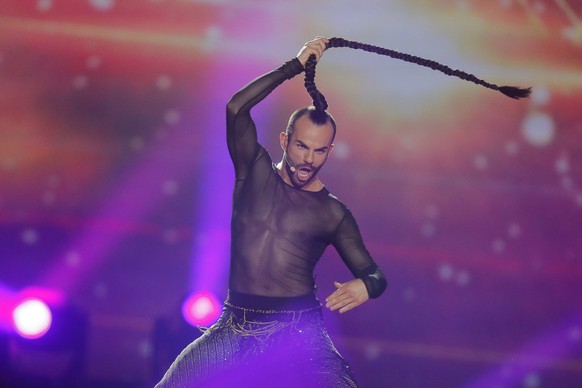 FILE - In this May 9, 2017 file photo, Slavko Kalezic from Montenegro performs the song &quot;Space&quot; during the first Semifinal for the Eurovision Song Contest, in Kiev, Ukraine. The coronavirus  ...