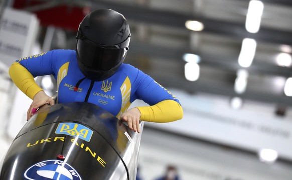 Ukraine&#039;s bobsleigh pilot Lidiia Hunko at the start of the women&#039;s monobob race at the Bobsleigh and Skeleton World Championships in Altenberg, Germany, Saturday, Feb.13, 2021. (AP Photo/Mat ...