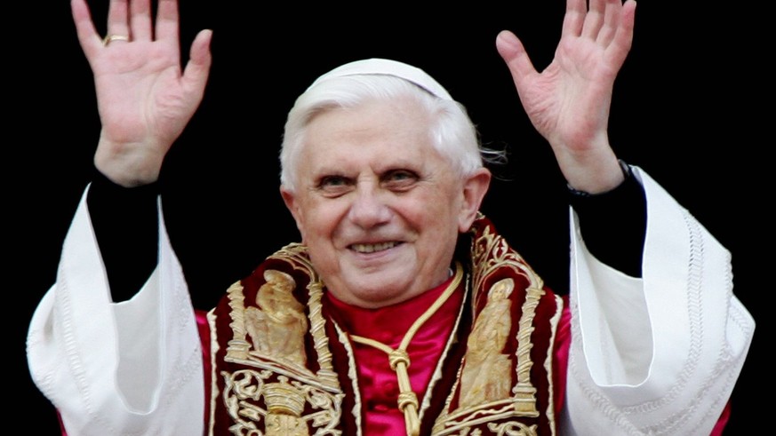 A photograph dated 19 April 2005 showing the newly elected Pope Benedict XVI as he greets pilgrims while standing on the balcony of Saint Peter&#039;s Basilica, in the Vatican, after his election. Car ...