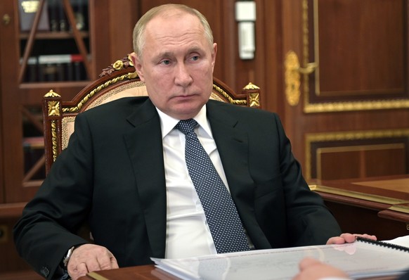 Russian President Vladimir Putin listens during a meeting in Moscow, Russia, Tuesday, March 22, 2022. (Mikhail Klimentyev, Sputnik, Kremlin Pool Photo via AP)