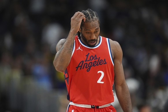 Los Angeles Clippers forward Kawhi Leonard heads to the bench during a timeout against in the second half of Game 7 of an NBA basketball first-round playoff series against the Denver Nuggets, Saturday ...
