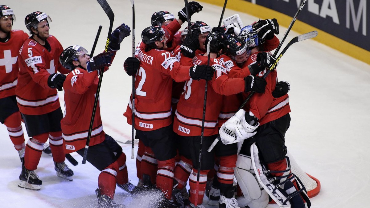 Switzerland's players celebrate their victory over USA, during the IIHF Ice Hockey World Championships semifinal match Switzerland vs USA at the Globe Arena in Stockholm, Sweden, on Saturday, 18  ...
