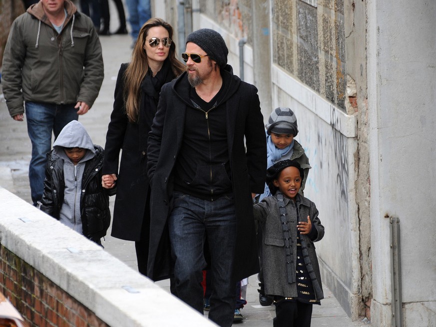 Actors Angelina Jolie and Brad Pitt are seen walking with children Maddox, right, Zahara, front right, and Pax, left, in Venice, Italy, Tuesday, Feb. 16, 2010. Angelina Jolie is in Venice to shoot sce ...