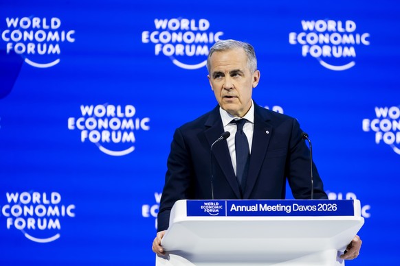 epa12664782 Canada Prime Minister Mark Carney speaks during a plenary session in the Congress Hall at the 56th annual meeting of the World Economic Forum (WEF) in Davos, Switzerland, 20 January 2026.  ...