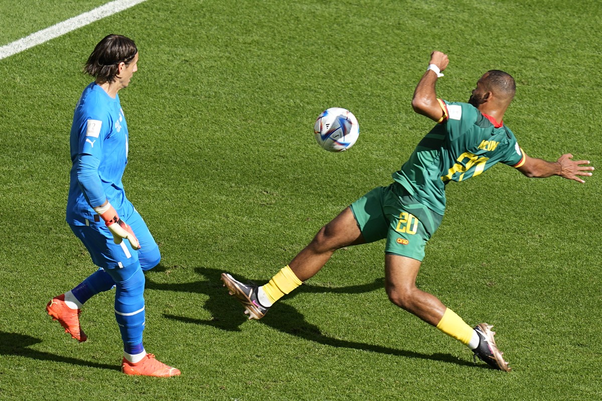 Switzerland's goalkeeper Yann Sommer, left, blocks Cameroon's Bryan Mbeumo's shot during the World Cup group G soccer match between Switzerland and Cameroon, at the Al Janoub Stadium in ...