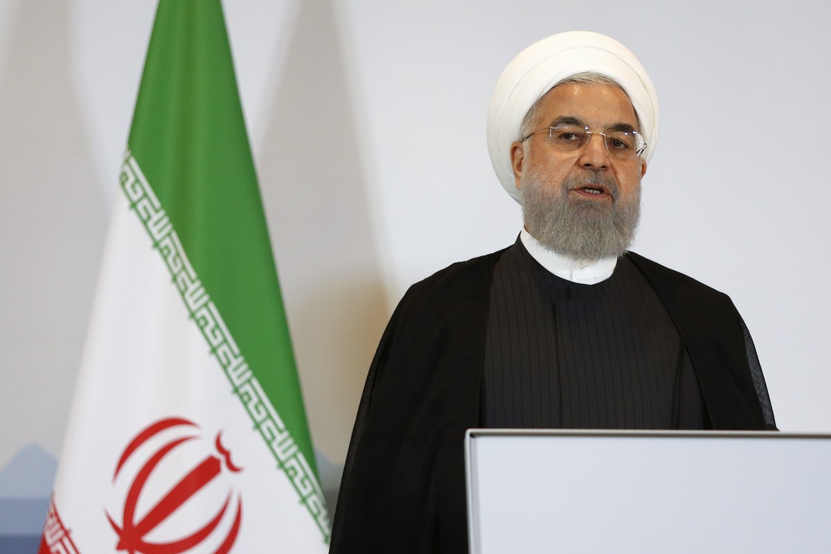 Iranian President Hassan Rohani addresses the media during a joint press conference with Swiss Federal President Alain Berset in Bern, Switzerland, Tuesday, July 3, 2018. (Peter Klaunzer/Keystone via  ...