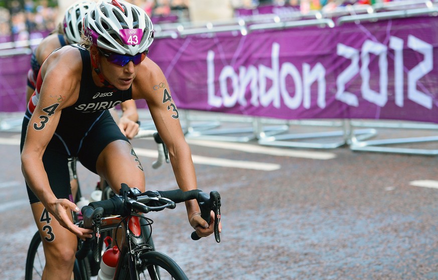 Switzerland&#039;s Nicola Spirig rides during the women&#039;s triathlon at the 2012 Summer Olympics in London on Saturday, Aug. 4, 2012. (AP Photo/Miguel Medina, Pool)