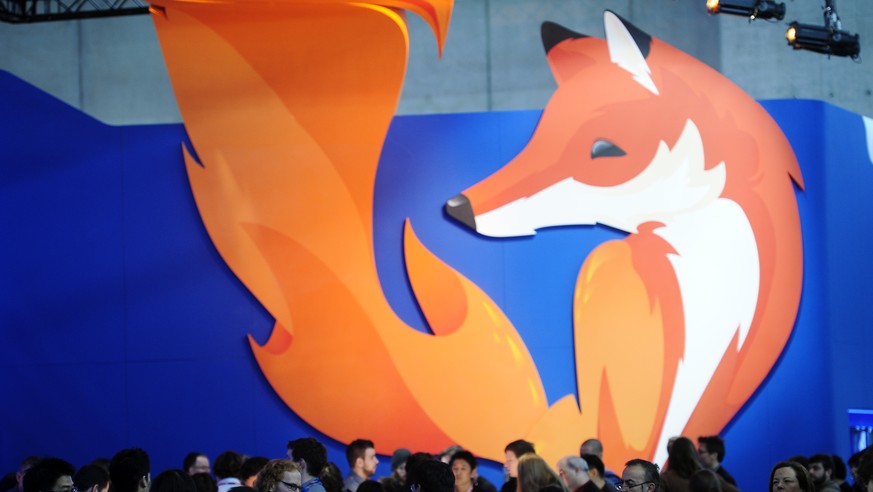 People gather in the Firefox booth at the Mobile World Congress, the world&#039;s largest mobile phone trade show in Barcelona, Spain, Thursday, Feb. 27, 2014. The global wireless show that wraps up o ...