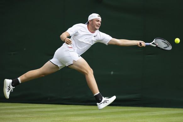 Dominic Stricker of Switzerland in action during his first round match against Alexei Popyrin of Australia at the All England Lawn Tennis Championships in Wimbledon, London, Wednesday, July 5, 2023. ( ...