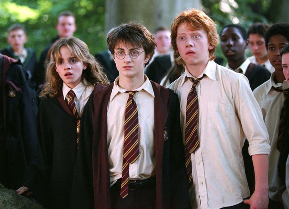 In this image released by Warner Bros., from left, Emma Watson as Hermione Granger, Daniel Radcliffe as Harry Potter and Rupert Grint as Ron Weasley are shown in a scene from &quot;Harry Potter and th ...