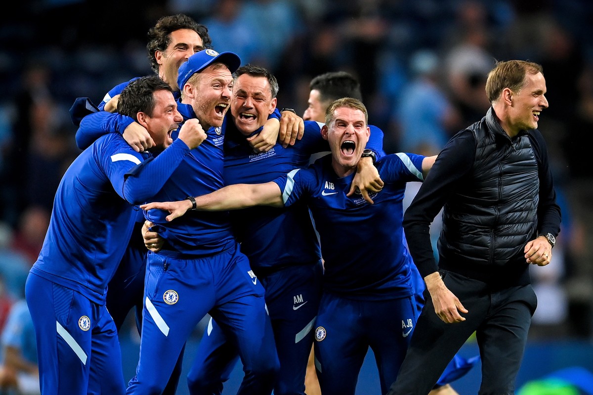 epa09235960 Chelsea's manager Thomas Tuchel (R) and his staff celebrate after winning the UEFA Champions League final between Manchester City and Chelsea FC in Porto, Portugal, 29 May 2021. EPA/D ...