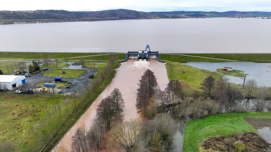 December 31, 2023, Saxony-Anhalt, Gelbra: Water is discharged from the Gelbra Dam into the Helm River (drone photo).  The dam reached its maximum capacity.  Rainy and snowy days...