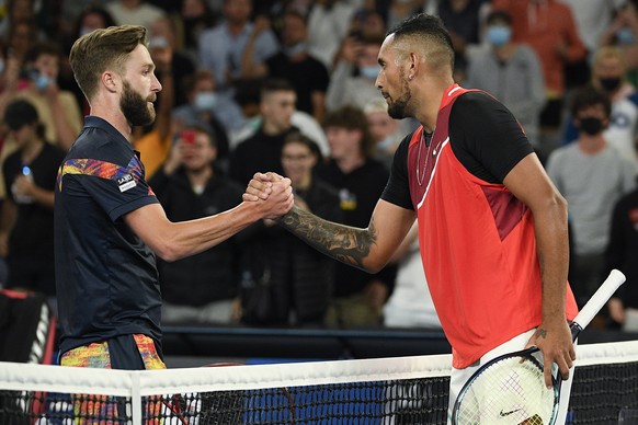 Nick Kyrgios, right, of Australia is congratulated by Liam Broady of Britain after winning their first round match at the Australian Open tennis championships in Melbourne, Australia, Tuesday, Jan. 18 ...