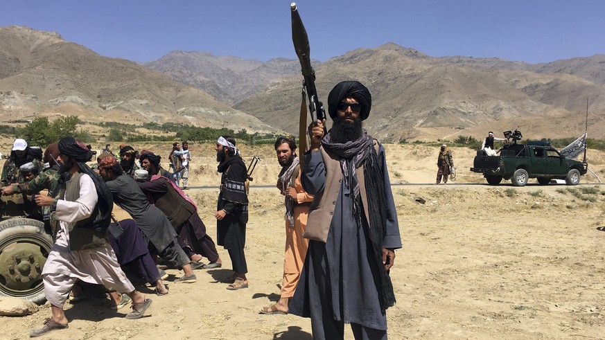 Taliban soldiers stand guard in Panjshir province northeastern of Afghanistan, Wednesday, Sept. 8, 2021. (AP Photo/Mohammad Asif Khan)
