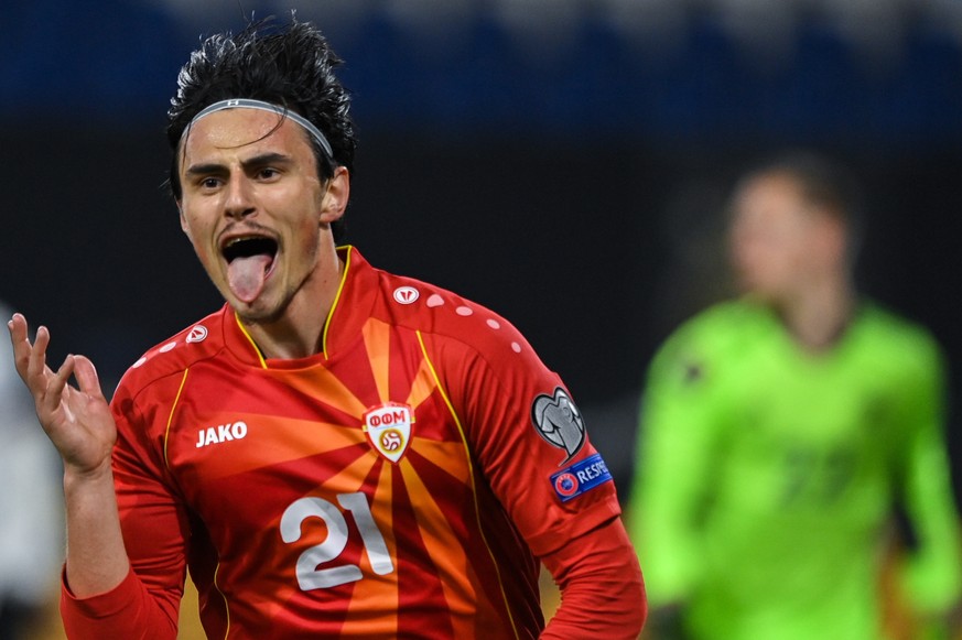 epa09109558 North Macedonia&#039;s Eljif Elmas (L) celebrates after scoring the 2-1 winning goal during the FIFA World Cup 2022 qualifying soccer match between Germany and North Macedonia in Duisburg, ...