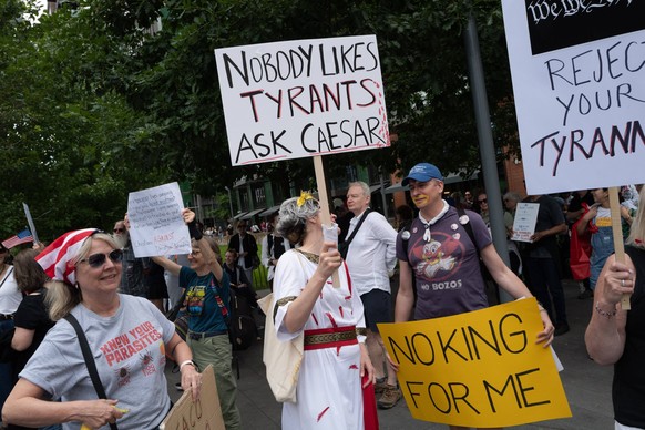June 14, 2025, London, England, United Kingdom: Supporters of U.S.-based activist group Indivisible stage a demonstration outside the U.S. Embassy in London, as part of a global ��oeNo Tyrants��� day  ...