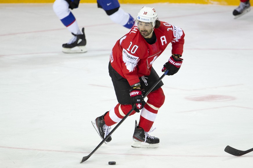 Switzerland&#039;s forward Andres Ambuehl controls the puck, during the IIHF 2021 World Championship preliminary round game between Switzerland and Slovakia, at the Olympic Sports Center, in Riga, Lat ...