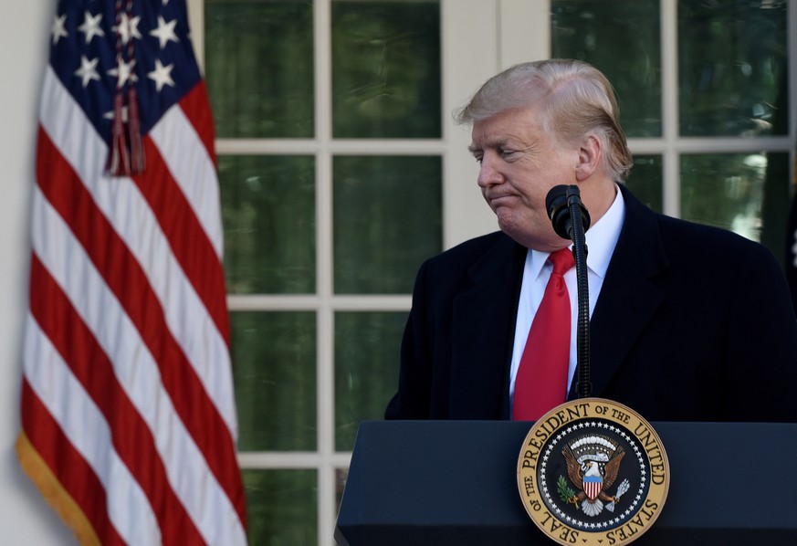 epa07319793 US President Donald J. Trump leaves the podium after making a statement announcing that a deal has been reached to reopen the government through Feb. 15 during an event in the Rose Garden  ...