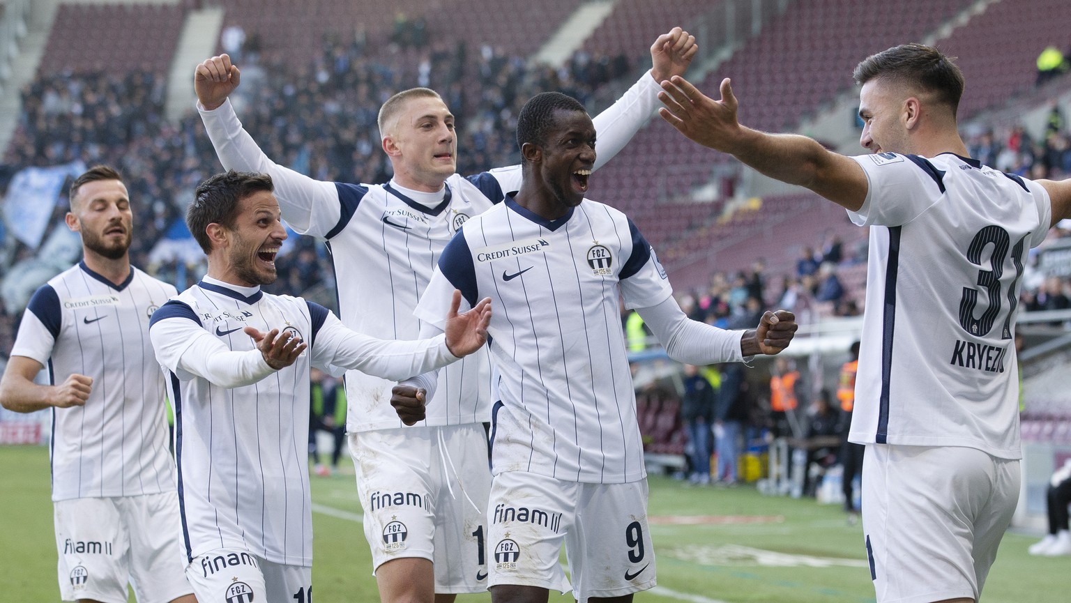 Zurich&#039;s defender Mirlind Kryeziu, right, celebrates his goal with teammates after scoring the 0:2, during the Super League soccer match of Swiss Championship between Servette FC and FC Zuerich,  ...