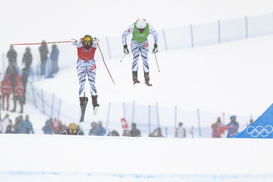 From left: Ryan Regez of Switzerland and Alex Fiva of Switzerland compete during the men's Freestyle Skiing Ski Cross Quaterfinal at the 2026 Olympic Winter Games in Livigno, Italy, on Saturday,  ...