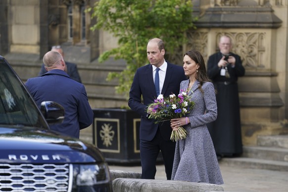 Britain&#039;s Prince William and his wife Kate the Duchess of Cambridge leave after attending the launch of the Glade of Light Memorial, outside Manchester Cathedral, which commemorates the victims o ...