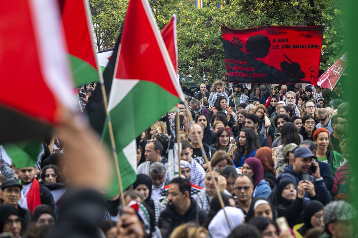 Protesters take part in a rally in support of Palestinians, in Geneva, Switzerland, Saturday, October 14, 2023. Thousands of Israelis and Palestinians have died since the militant group Hamas launched ...