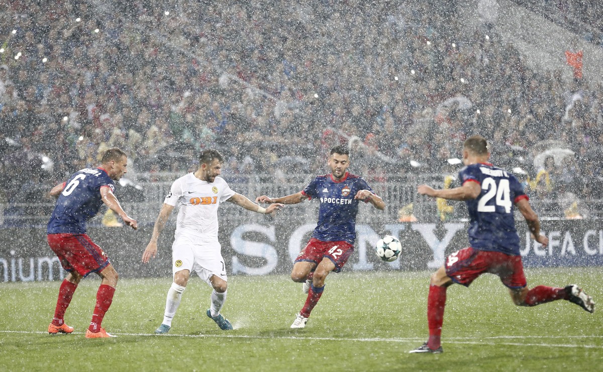 YB's Miralem Sulejmani, 2nd left, against ZSKA's Aleksei Berezutski, Georgi Schennikov and Vasili Berezutski, L-R, during the the UEFA Champions League playoff match between Russia's CS ...