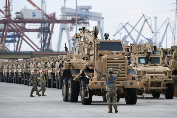epa10000566 US Army staff prepare American military equipment transport, in the port of Gdynia, in Gdynia, Poland, 07 June 2022. The equipment will be shipped to USA for a technical inspection. EPA/AD ...