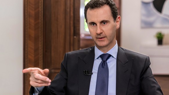 epa06837012 Syrian President Bashar al-Assad gives an interview to the Russian NTV Channel in Damascus, Syria, 24 June 2018. Assad affirmed that any constitutional reform in Syria should be done by a  ...