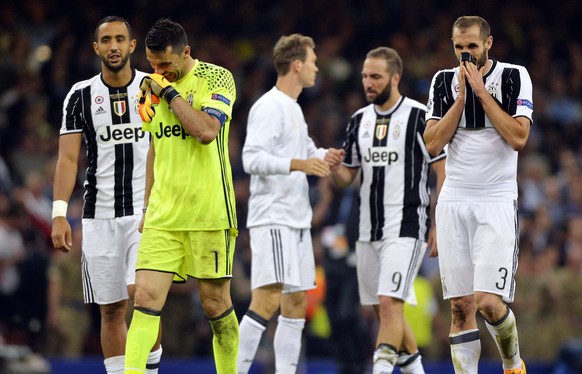 epa06008828 Juventus goalkeeper Gianluigi Buffon and defender Giorgio Chiellini (R) react after the end of the UEFA Champions League final between Juventus FC and Real Madrid at the National Stadium o ...