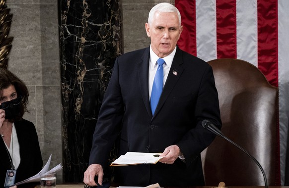 FILE - Vice President Mike Pence officiates as a joint session of the House and Senate convenes to confirm the Electoral College votes cast in November&#039;s election, at the Capitol in Washington, W ...