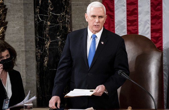 FILE – Vice President Mike Pence acts as a joint session of the House and Senate to confirm Electoral College votes cast in the November election, at the Capitol in Washington, Wednesday…