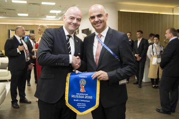 Swiss Federal President Alain Berset, right, and FIFA President Gianni Infantino shake hands prior to the FIFA soccer World Cup 2018 group E match between Switzerland and Brazil at the Rostov Arena, i ...