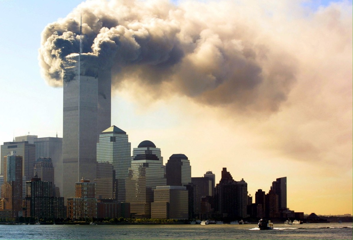Balls of flames and smoke billow out of the top floors of the World Trade Center Towers September 11, 2001 in New York City, USA. Witnesses say two separate planes flew into the towers, in what is sus ...