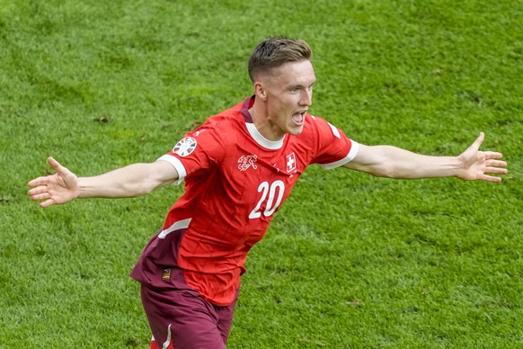 Switzerland&#039;s Michel Aebischer celebrates after scoring his second goal during a Group A match between Hungary and Switzerland at the Euro 2024 soccer tournament in Cologne, Germany, Saturday, Ju ...