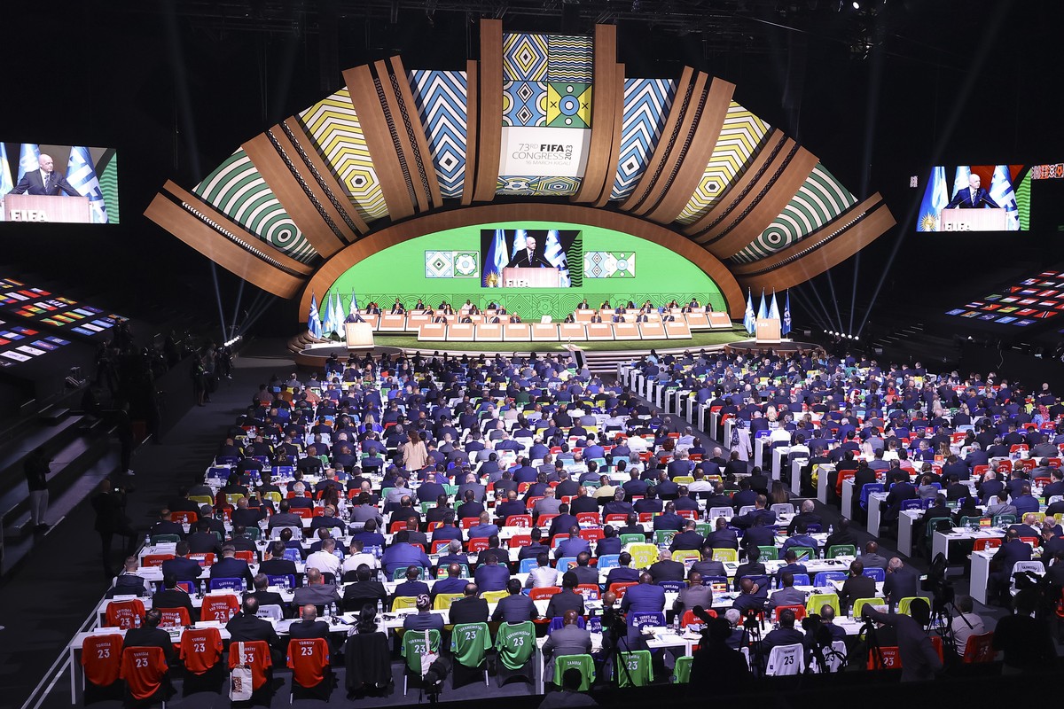 FIFA president Gianni Infantino is seen on video screens as he speaks at the 73rd FIFA Congress, held in Kigali, Rwanda Thursday, March 16, 2023. Infantino was re-elected by acclaim to another four-ye ...