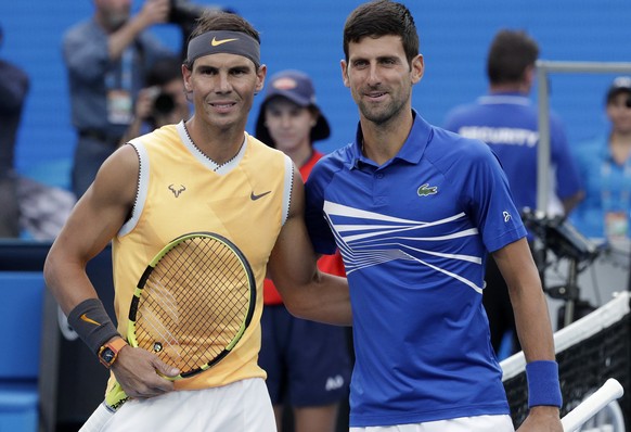 Spain&#039;s Rafael Nadal, left, poses for a photo with Serbia&#039;s Novak Djokovic ahead of the men&#039;s singles final at the Australian Open tennis championships in Melbourne, Australia, Sunday,  ...