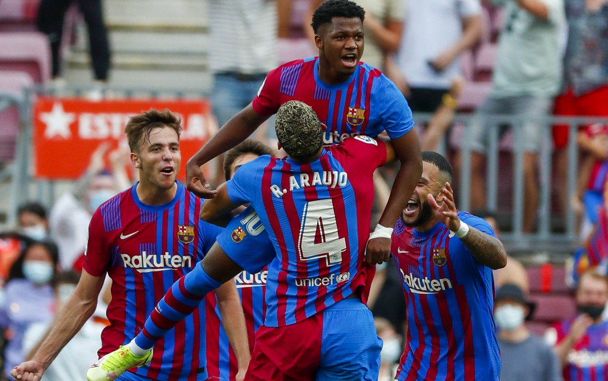 Barcelona's Ansu Fati celebrates after scoring his side's third goal during a Spanish La Liga soccer match between FC Barcelona and Levante at the Camp Nou stadium in Barcelona, Spain, Sunda ...
