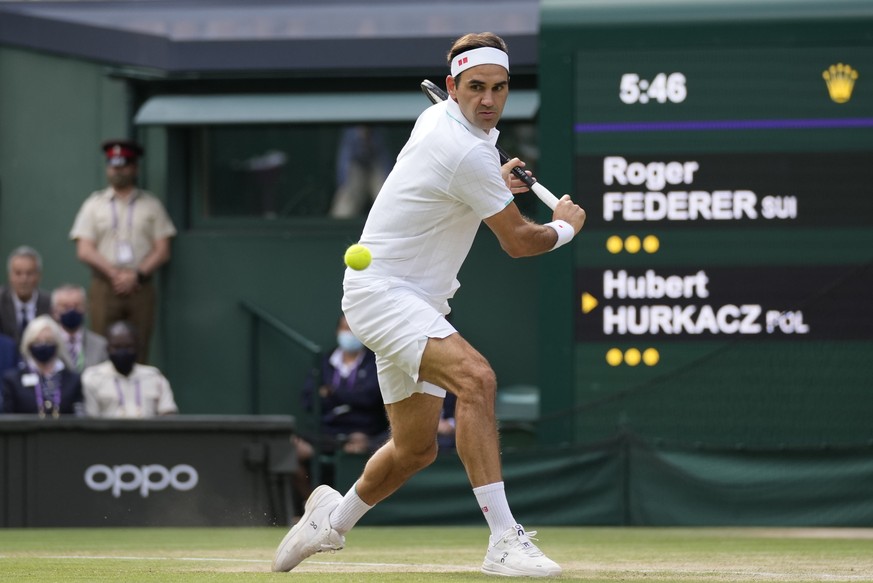 FILE - In this July 7, 2021, file photo, Switzerland&#039;s Roger Federer plays a return to Poland&#039;s Hubert Hurkacz during the men&#039;s singles quarterfinals match on the ninth day of the Wimbl ...