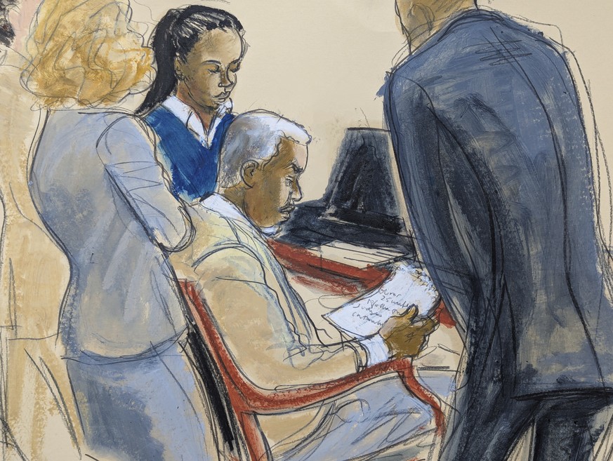 Sean &#039; Diddy&#039; Combs, center, reads a jury note with his defense attorneys during jury deliberations for his sexual misconduct trial in Manhattan federal court, Monday, June 30, 2025, in New  ...