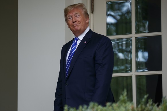 President Donald Trump walks into the Oval Office of the White House for a meeting with Mongolian President Khaltmaa Battulga, Wednesday, July 31, 2019, in Washington. (AP Photo/Evan Vucci)
Donald Tru ...